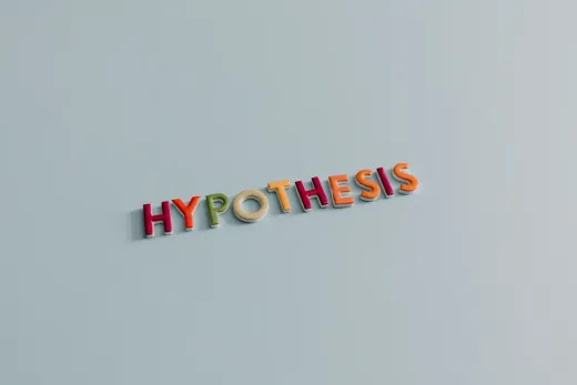 Colourful letters spelling the word hypothesis on a pale grey surface