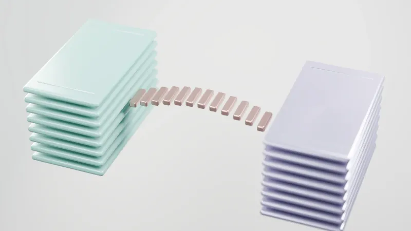 Two stacks of glossy tiles connected by a row of small bridge pieces